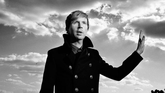 Beck holding out his hand